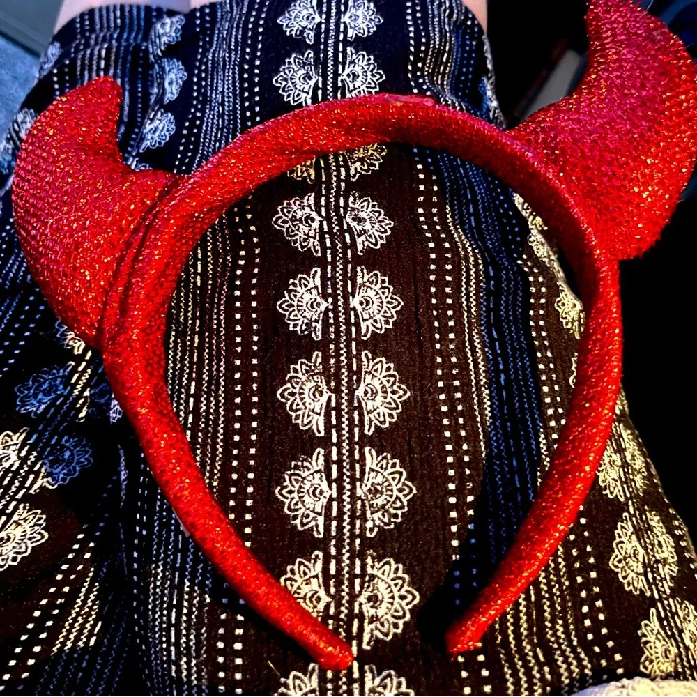It’s a Red Devil Headband. The whole thing is covered with red sparkly glitter.